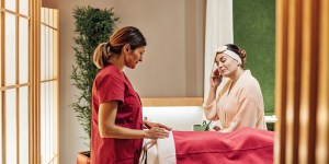 Woman discussing laser skin resurfacing recovery with a medical spa clinician