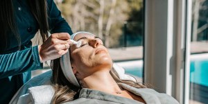 Woman gently caring for her skin after microneedling